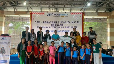 wom finance berbagi natal bersama SD ujungpandang dan SD Kondo Sapata